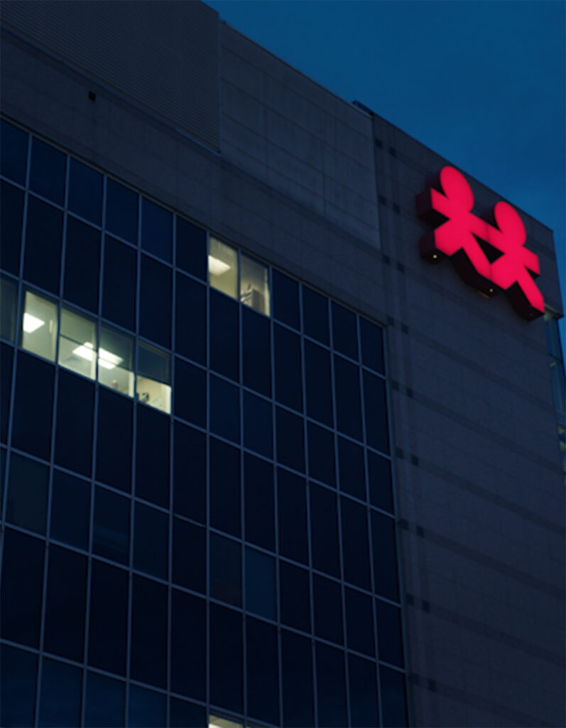 the illuminated logo on the front of the monroe carell jr. children's hospital building